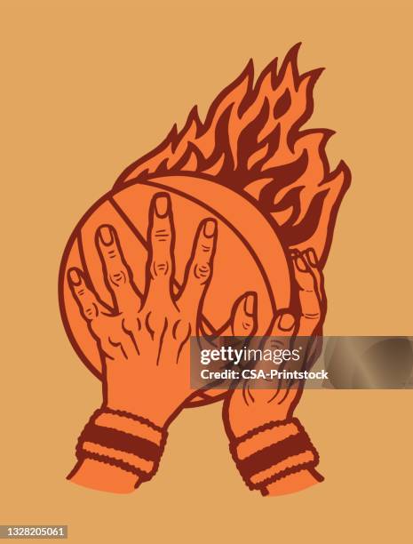 human hands holding basketball with flames - basketball ball stock illustrations