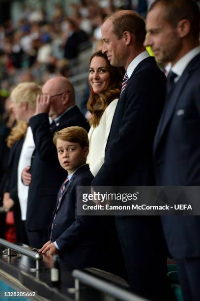 Prince George of Cambridge, Catherine, Duchess of Cambridge, and Prince William, Duke of Cambridge and President of the Football Association are seen...
