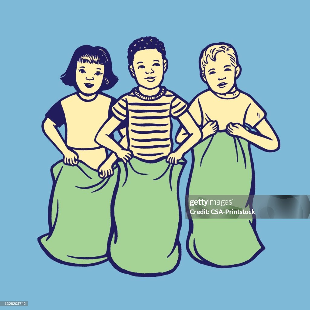 Three children having sack race