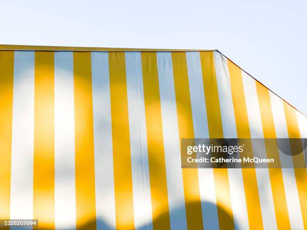 festive outdoor striped event tent - striped awning stock pictures, royalty-free photos & images