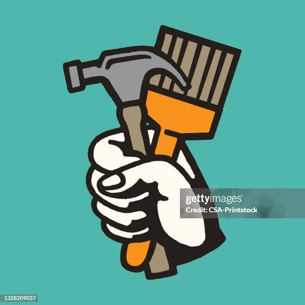 hand holding hammer and paintbrush - hammer logo stock illustrations