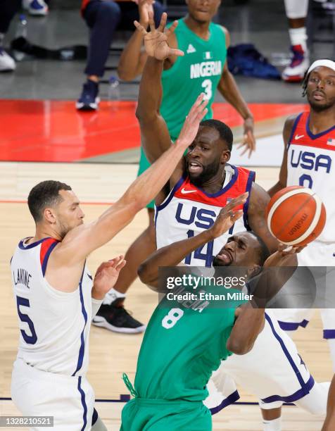 Ekpe Udoh of Nigeria is fouled by Draymond Green of the United States as Zach LaVine of the United States defends during an exhibition game at...