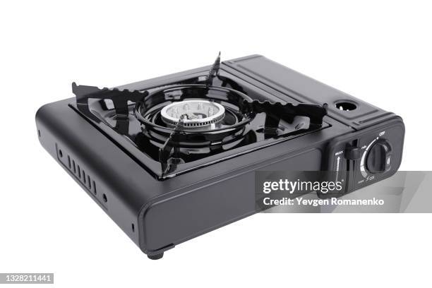 portable gas stove for camping, hiking and picnics, isolated on white background - camping stove stockfoto's en -beelden