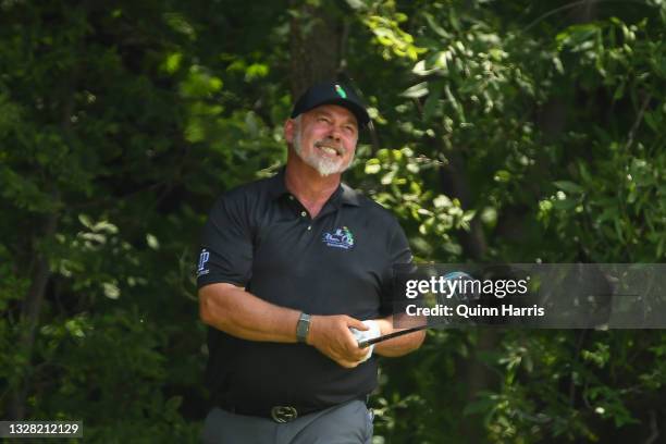 Darren Clarke of Northern Ireland plays his shot on the sixth tee during the final round of the U.S. Senior Open Championship at the Omaha Country...