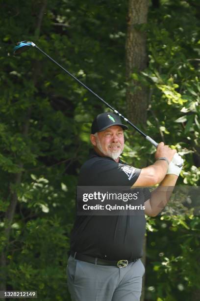 Darren Clarke of Northern Ireland plays his shot on the sixth tee during the final round of the U.S. Senior Open Championship at the Omaha Country...