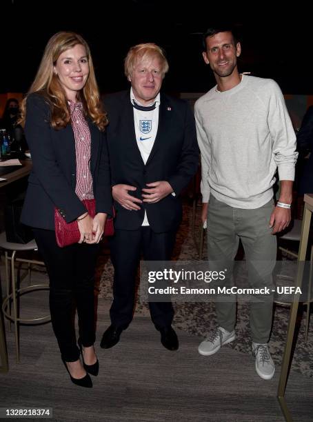 Boris Johnson, Prime Minister of England, his wife, Carrie Johnson and Tennis Player and Wimbledon 2021 Men's Singles Champion, Novak Djokovic pose...