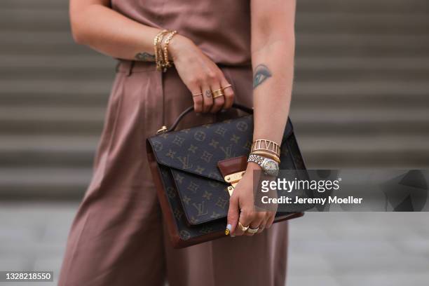 Masha Sedgwick wearing beige hello ben two piece and Louis Vuitton monogram leather bag on July 06, 2021 in Berlin, Germany.