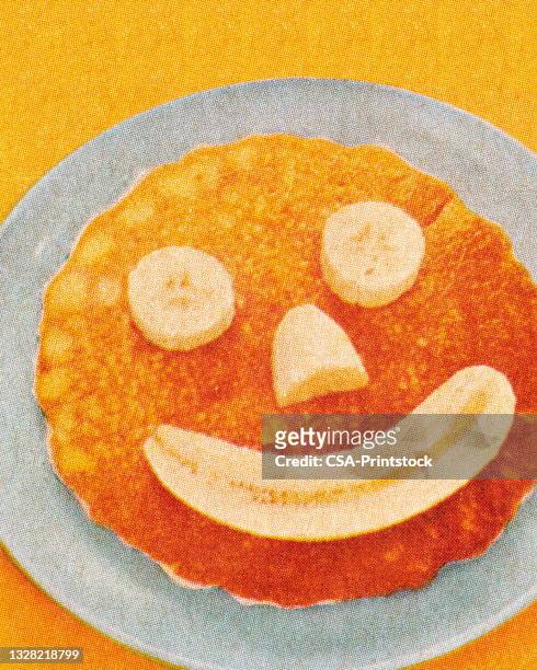 banana smile on a pancake - pancakes stock illustrations