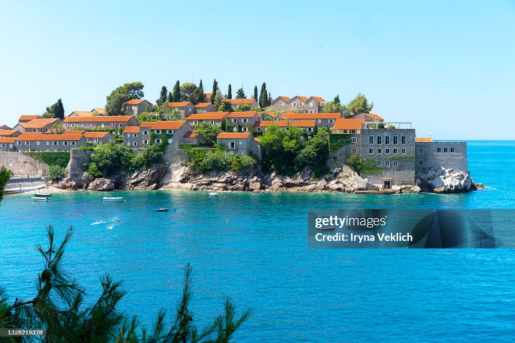 Beautiful Mediterranean landscape. Sveti Stefan island in Budva in a beautiful summer day, Montenegro, Montenegro.