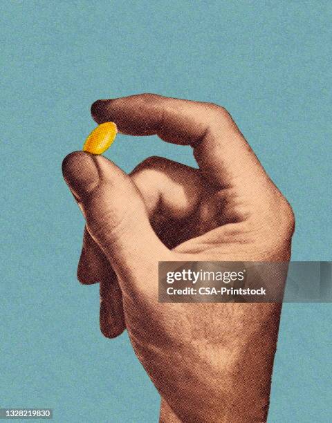 fingers holding a capsule - tablet vertical stock illustrations