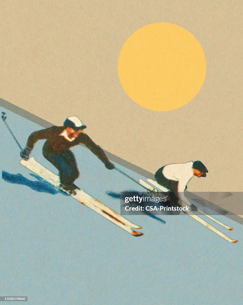 Two Skiers Racing Down a Hill