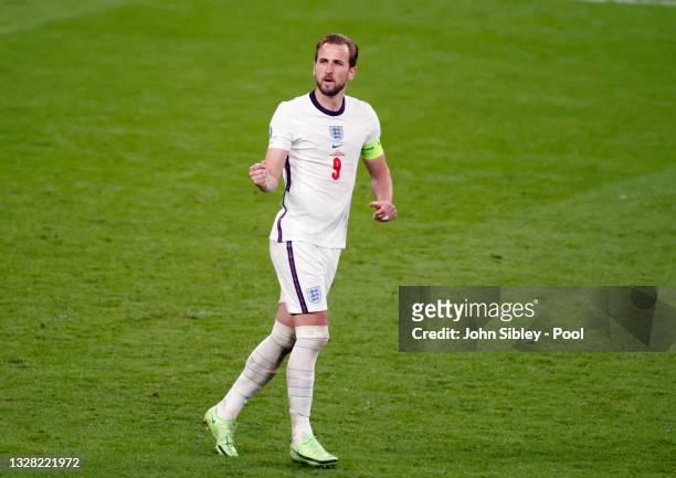 Harry Kane of England celebrates scoring their team's first penalty in the penalty shoot out during the UEFA Euro 2020 Championship Final between...