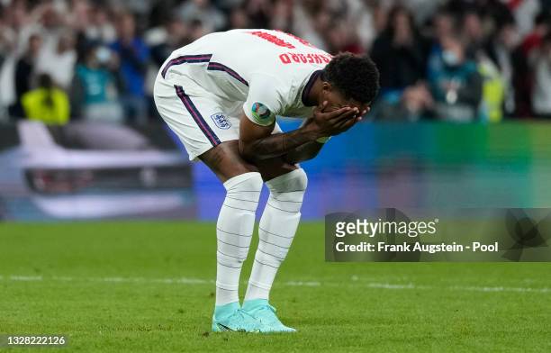 Marcus Rashford of England reacts after missing their team's third penalty in the penalty shoot out during the UEFA Euro 2020 Championship Final...