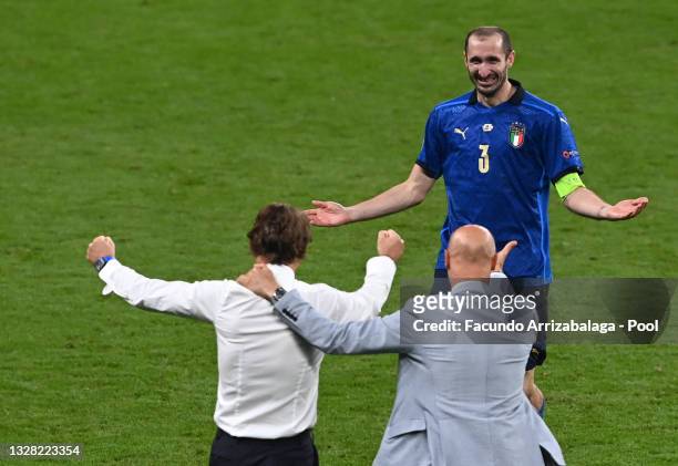 Roberto Mancini, Head Coach of Italy and Giorgio Chiellini of Italy celebrate following their team's victory in the UEFA Euro 2020 Championship Final...