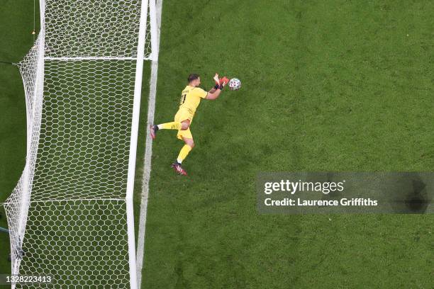 Gianluigi Donnarumma of Italy saves England's fifth, and the decisive penalty in a penalty shoot out from Bukayo Saka of England meaning Italy win...