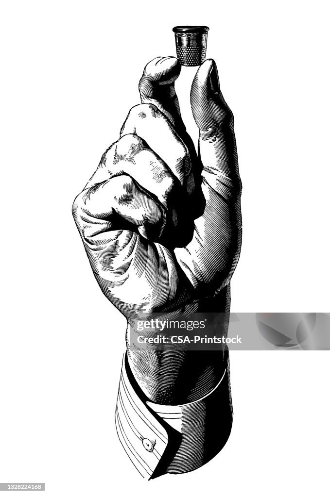 Hand Holding Fingerhut