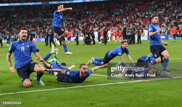 Francesco Acerbi, Leonardo Bonucci and teammates celebrate after victory in the UEFA Euro 2020 Championship Final between Italy and England at...