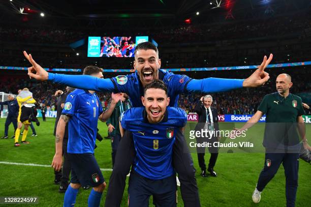 Leonardo Spinazzola and Jorginho of Italy celebrate following their team's victory in the UEFA Euro 2020 Championship Final between Italy and England...