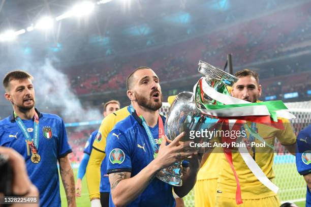 Leonardo Bonucci of Italy celebrates with The Henri Delaunay Trophy following his team's victory in the UEFA Euro 2020 Championship Final between...