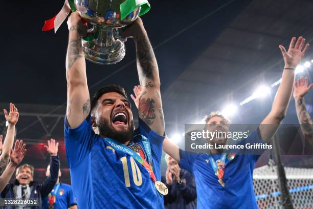 Lorenzo Insigne of Italy lifts The Henri Delaunay Trophy following his team's victory in the UEFA Euro 2020 Championship Final between Italy and...