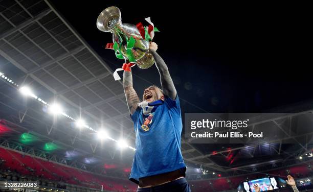 Federico Bernardeschi of Italy celebrates with The Henri Delaunay Trophy following his team's victory in the UEFA Euro 2020 Championship Final...