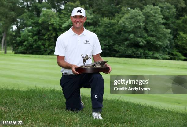 Lucas Glover poses with the trophy after his win in the final round of the John Deere Classic at TPC Deere Run on July 11, 2021 in Silvis, Illinois.