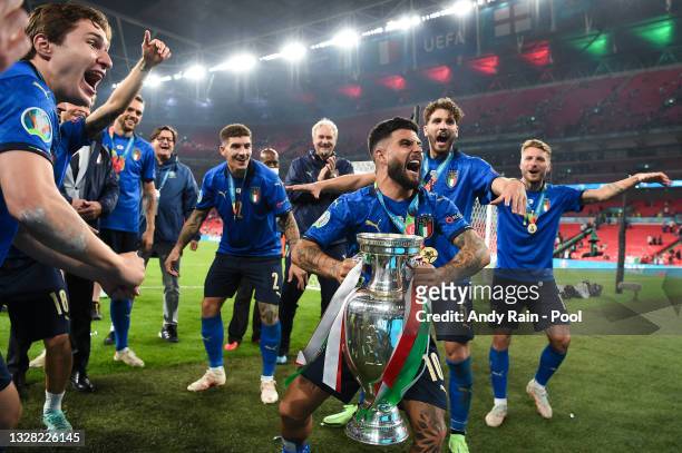 Lorenzo Insigne of Italy celebrates with The Henri Delaunay Trophy following his team's victory in the UEFA Euro 2020 Championship Final between...
