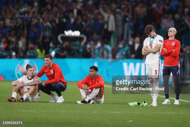 Kalvin Phillips, Ben White, Jude Bellingham, John Stones and Phil Foden of England look dejected following defeat in the UEFA Euro 2020 Championship...