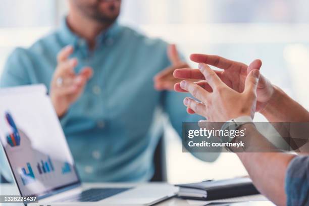 close up of a businessman hands during a meeting. - data selective focus stock pictures, royalty-free photos & images