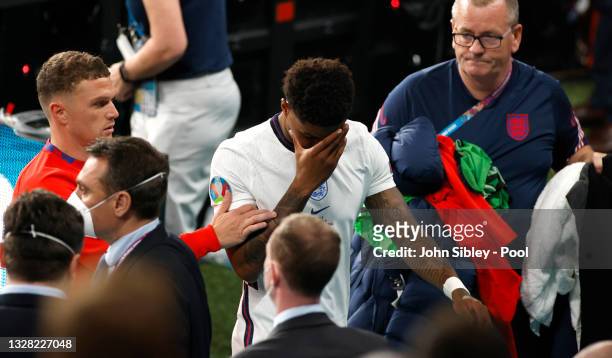 Marcus Rashford of England is consoled by team mate Kieran Trippier after the penalty shoot out after the UEFA Euro 2020 Championship Final between...
