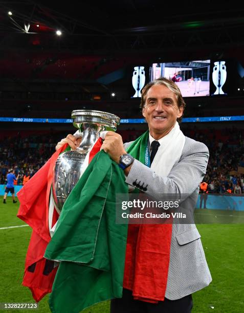 Roberto Mancini, Head Coach of Italy celebrates with The Henri Delaunay Trophy following his team's victory in the UEFA Euro 2020 Championship Final...