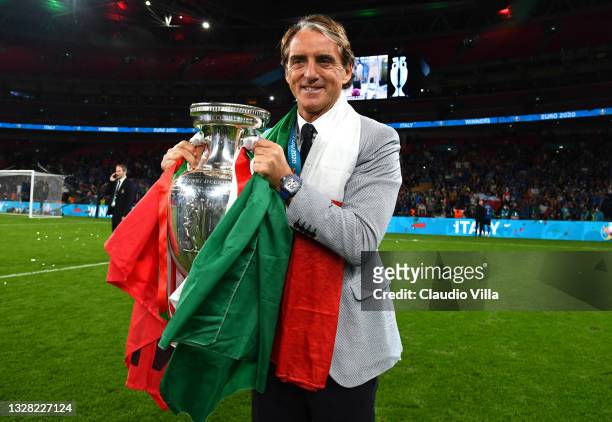 Roberto Mancini, Head Coach of Italy celebrates with The Henri Delaunay Trophy following his team's victory in the UEFA Euro 2020 Championship Final...