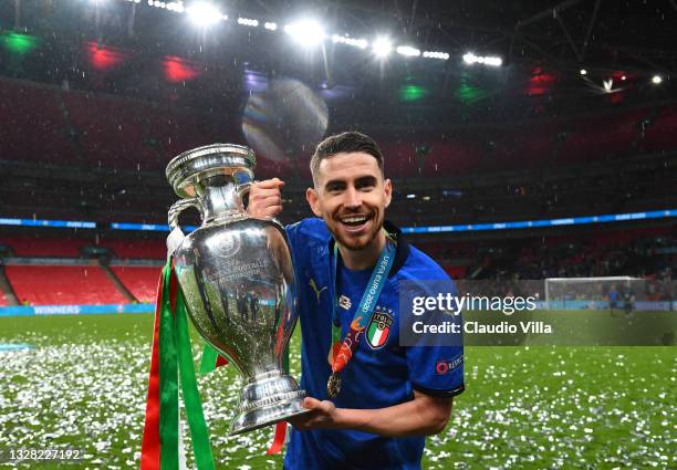 Jorginho of Italy celebrates with The Henri Delaunay Trophy following his team's victory in the UEFA Euro 2020 Championship Final between Italy and...