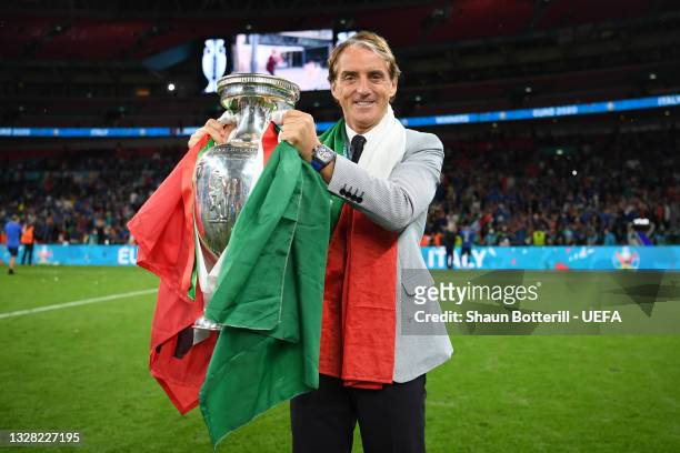 Roberto Mancini, Head Coach of Italy celebrates with The Henri Delaunay Trophy following his team's victory in the UEFA Euro 2020 Championship Final...