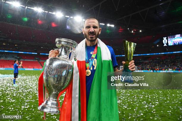 Leonardo Bonucci of Italy celebrates with The Henri Delaunay Trophy and his Heineken "Star of the Match" award following his team's victory in the...