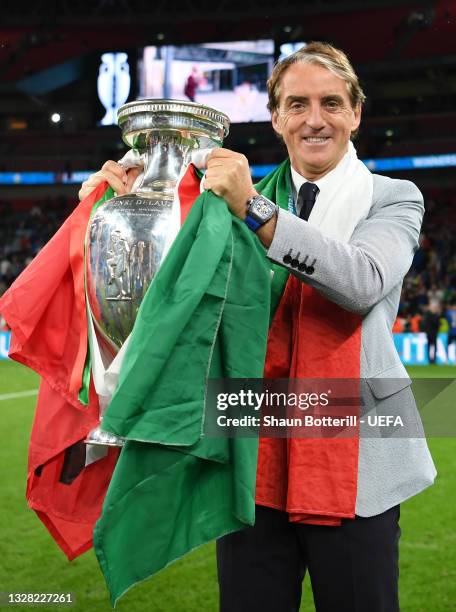 Roberto Mancini, Head Coach of Italy celebrates with The Henri Delaunay Trophy following his team's victory in the UEFA Euro 2020 Championship Final...