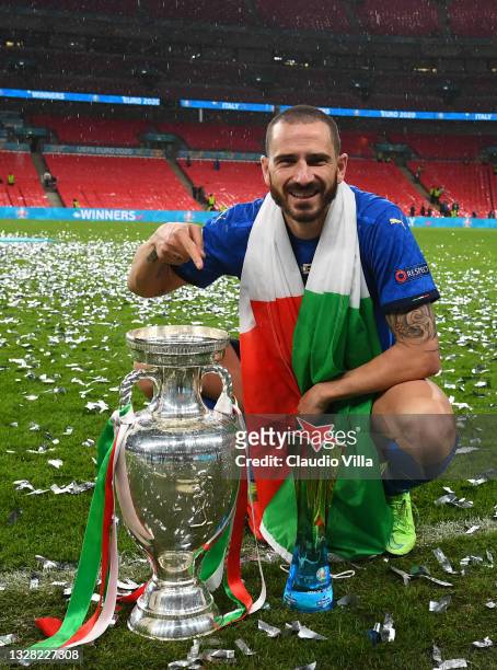 Leonardo Bonucci of Italy celebrates with The Henri Delaunay Trophy and his Heineken "Star of the Match" award following his team's victory in the...