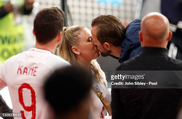 Harry Kane of England kisses wife Katie Goodland following the UEFA Euro 2020 Championship Final between Italy and England at Wembley Stadium on July...