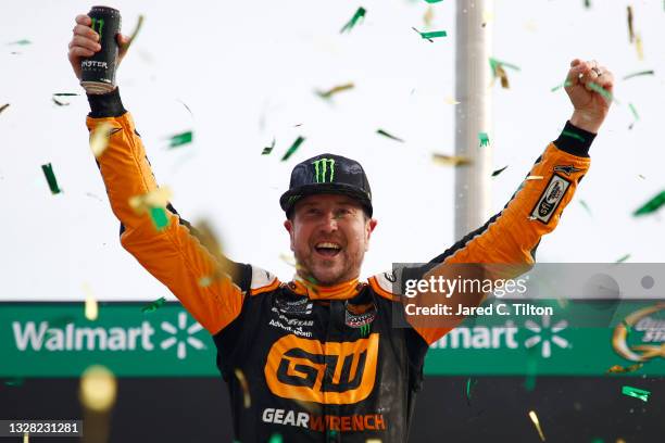 Kurt Busch, driver of the GEARWRENCH Chevrolet, celebrates in victory lane after winning the NASCAR Cup Series Quaker State 400 presented by Walmart...