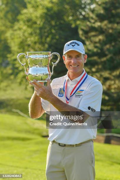 Jim Furyk of the United States poses with the trophy after winning the U.S. Senior Open Championship at the Omaha Country Club on July 11, 2021 in...