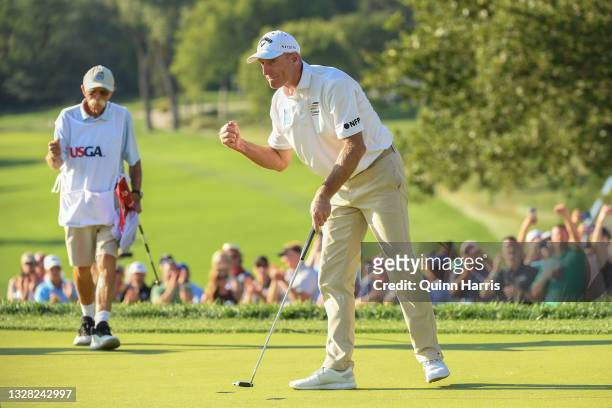 Jim Furyk of the United States reacts in front of Michael "Fluff" Cowan after winning the U.S. Senior Open Championship at the Omaha Country Club on...