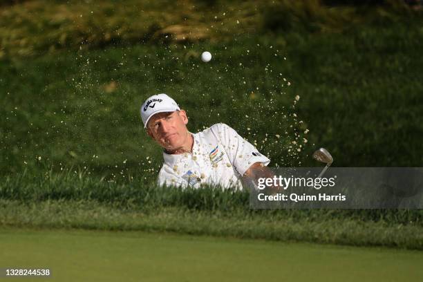 Jim Furyk of the United States plays his shot from the bunker on the 13th hole during the final round of the U.S. Senior Open Championship at the...