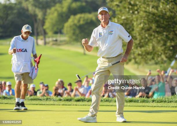 Jim Furyk of the United States reacts in front of Michael "Fluff" Cowan after winning the U.S. Senior Open Championship at the Omaha Country Club on...