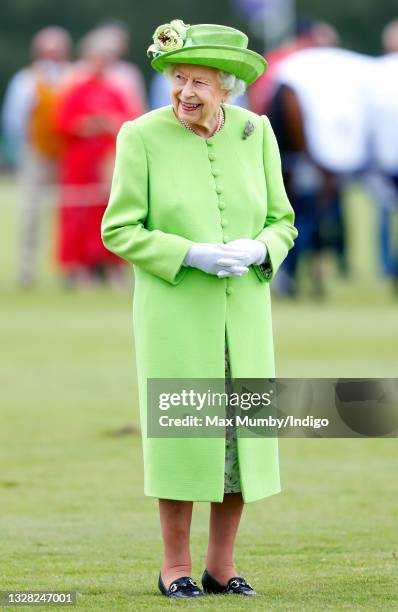 Queen Elizabeth II attends the Out-Sourcing Inc. Royal Windsor Cup polo match and a carriage driving display by the British Driving Society at Guards...