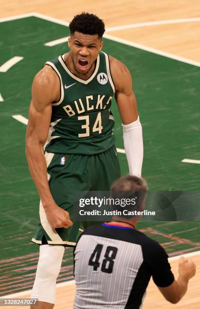 Giannis Antetokounmpo of the Milwaukee Bucks celebrates during the second half in Game Three of the NBA Finals at Fiserv Forum on July 11, 2021 in...