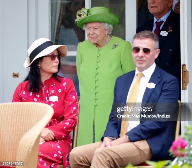 Queen Elizabeth II attends the Out-Sourcing Inc. Royal Windsor Cup polo match and a carriage driving display by the British Driving Society at Guards...