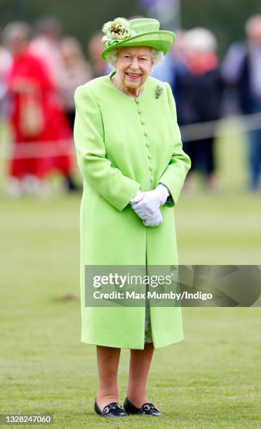 Queen Elizabeth II attends the Out-Sourcing Inc. Royal Windsor Cup polo match and a carriage driving display by the British Driving Society at Guards...