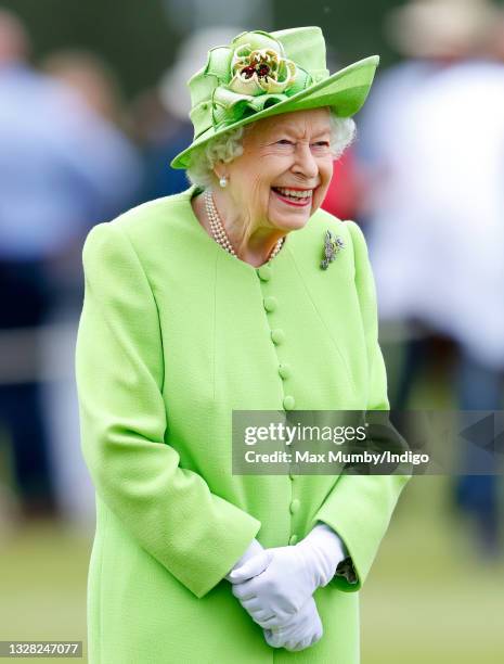 Queen Elizabeth II attends the Out-Sourcing Inc. Royal Windsor Cup polo match and a carriage driving display by the British Driving Society at Guards...