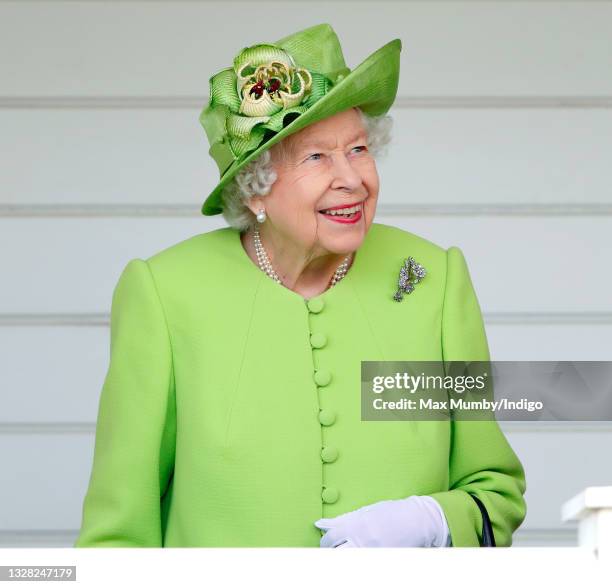 Queen Elizabeth II attends the Out-Sourcing Inc. Royal Windsor Cup polo match and a carriage driving display by the British Driving Society at Guards...