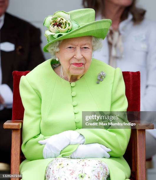 Queen Elizabeth II attends the Out-Sourcing Inc. Royal Windsor Cup polo match and a carriage driving display by the British Driving Society at Guards...